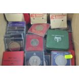 A collection of British coins, including commemorative crowns etc