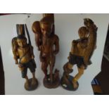 Three carved West African figures. Tallest 83cm height