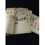 Three well stocked stamp albums.&nbsp;