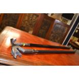 2 Walking sticks with unscrewable handles and hollow shafts, probably ex sword sticks