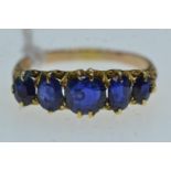 Yellow metal &amp; five stone sapphire ring, tests positive for 18ct gold, size N, 2.87 grams