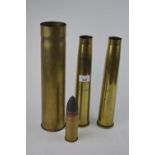 Four shell cases, including two marked H.M.S. Bulwark 1971