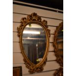 Oval Gilt mirror. W32cm H62cm.