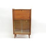 Small Mid century&nbsp;style Oak display cabinet with Pull down top compartment. W61cm D25cm H108.