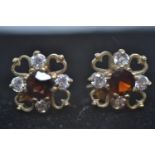 Pair of 9ct gold ruby and diamond earrings, gross weight 1.3g