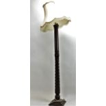 Mahogany standard lamp with carved detail and twist to shaft. H155cm.