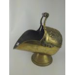 Brass coal scuttle with floral decoration and wooden handle