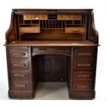 Oak Roll top Tambour fronted pedestal desk with key.  W127cm D82cm H130cm.