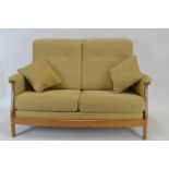 Elm framed two seater Ercol sofa in natural finish h90cm x w144cm x d70cm