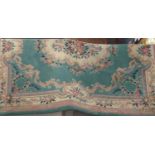 Green Chinese floral bordered wool rug with central medallion 310cm x 240cm