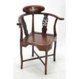 Chinese rosewood corner chair, with fretworked cherry blossom supports &amp; mother of pearl inset d