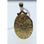 Yellow metal locket pendant, tests positive for 9ct gold, initialled 'MH' to front, length including