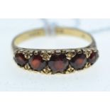9ct gold ring set with 5 garnet coloured stones, size Q/R, 3.2 grams