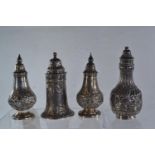 Four silver HM pepperettes, including a pair, various makers &amp; dates, gross weight 113.97