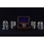 Silver thimble by Charles Horner, Chester 1902, &amp; four other silver thimbles, gross weight 17.4