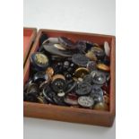 Buttons in wooden box, including some military