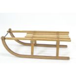 Traditional Davos toboggan, with ash and oak frame (with repairs, and break to one slat) with metal