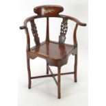 Chinese rosewood corner chair, with fretworked cherry blossom supports &amp; mother of pearl inset d