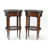A pair of Theodore Alexander oval poplar burl lamp tables, the burl veneer top with a patinated bras