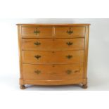 Pine bow fronted 2 over 3 chest of drawers, raised on bun supports. W114cm D52cm H116cm