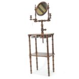 Edwardian oak shaving stand. Central mirror flanked by brass-lined candle stands, over 2 small drawe