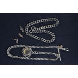 Two silver watch chains, one with compass fob, gross weight 74.15, &amp; three white metal charms