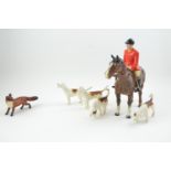 Beswick huntsman, hounds and fox.