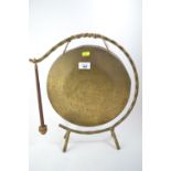 Brass gong on frame with dong. 40cm high