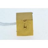 Yellow metal &amp; enamel 'Jack in the Box' charm, box tests positive for 18ct gold, gross weight 6.