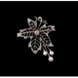 An Edwardian diamond, emerald and pearl leaf brooch/pendant