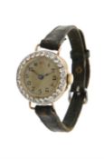 Unsigned, Lady's 18 carat gold and diamond wrist watch