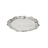 An Edwardian silver shaped circular salver by Joseph Rodgers & Sons