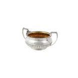 A George III silver twin handled sugar bowl by Samuel Hennell & John Terry