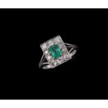 A mid 20th century diamond and emerald cluster ring