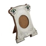 An Art Nouveau silver mounted and enamel shaped rectangular photo frame by William Hutton & Sons Ltd