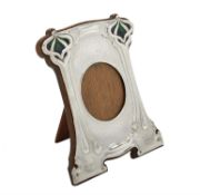 An Art Nouveau silver mounted and enamel shaped rectangular photo frame by William Hutton & Sons Ltd