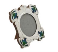 An Art Nouveau silver mounted and enamel shaped square photo frame by William Hutton & Sons Ltd.