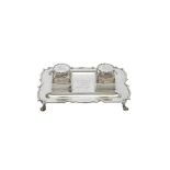 An Edwardian silver shaped rectangular inkstand by Goldsmiths & Silversmiths Co. Ltd.