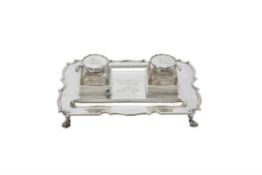 An Edwardian silver shaped rectangular inkstand by Goldsmiths & Silversmiths Co. Ltd.