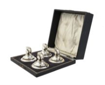 A cased set of four menu holders by Crisford & Norris Ltd.