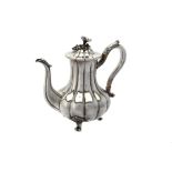 Y An Early Victorian silver lobed baluster coffee pot by Robert Hennell
