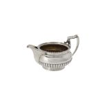 A George III silver half lobed cream jug by Samuel Hennell & John Terry