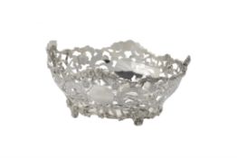A silver oval pierced bowl by C. S. Harris & Sons Ltd.