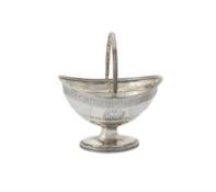 A George III silver oval swing handled pedestal basket by Henry Chawner