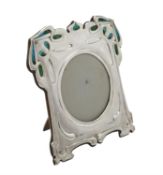 An Art Nouveau silver mounted and enamel shaped square photo frame by William Hutton & Sons Ltd.