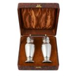 A cased pair of silver sugar casters by G. Bryan & Co.