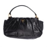 Prada, a black leather handbag