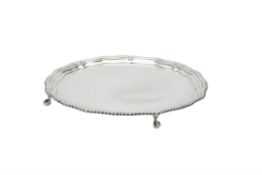 A silver shaped circular salver by Barker Brothers Silver Ltd.