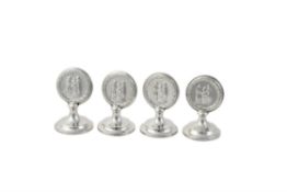 A set of four Edwardian silver menu holders by William Comyns