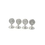 A set of four Edwardian silver menu holders by William Comyns